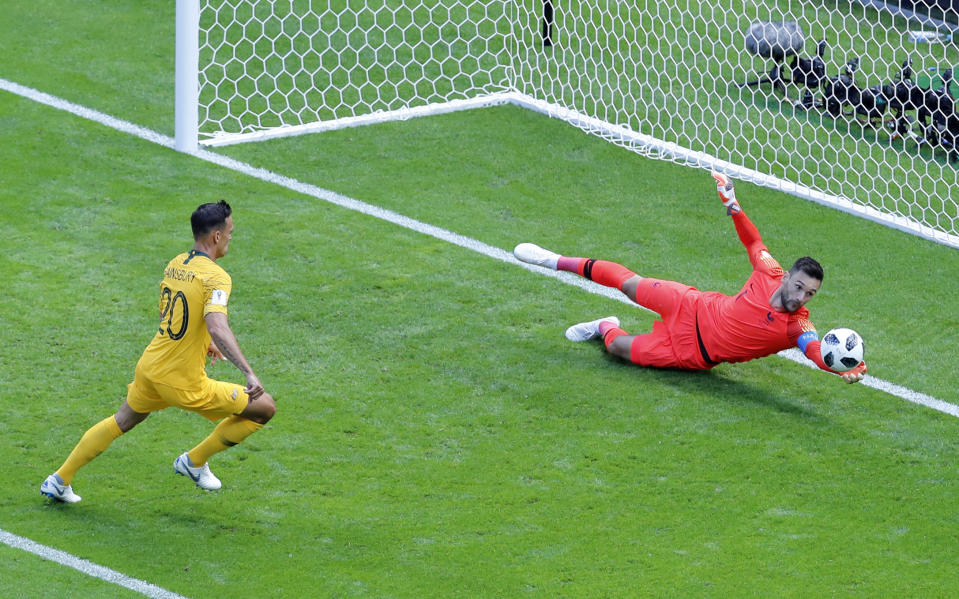 France goalkeeper Hugo Lloris, right, makes a save in front of Australia’s Trent Sainsbury (AP Photo/Hassan Ammar)