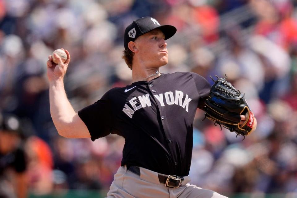 New York Yankees starting pitcher Clayton Beeter throws in the fourth inning of a spring training baseball game against the Philadelphia Phillies Monday, March 11, 2024, in Clearwater, Fla. (AP Photo/Charlie Neibergall)