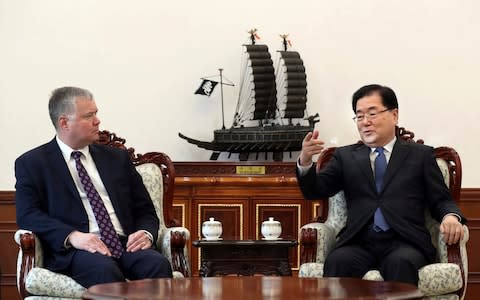 U.S. Special Representative for North Korea Stephen Biegun, left, talks with South Korean National Security Director Chung Eui-yong during a meeting at the Presidential Blue House in Seoul, South Korea - Credit: AP