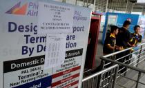 A sign at the Philippine Airlines counter at Manila International airport informs people of the flights' cancellations due to Super Typhoon Haiyan which struck the central Philippines on Friday, November 8, 2013