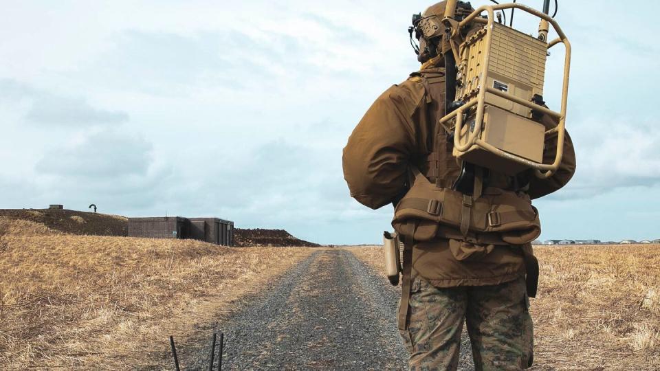 A Marine Corps Explosive Ordnance Disposal Technician, assigned to the 22nd Marine Expeditionary Unit, stands beside a 310 Small Unmanned Ground Vehicle during an EOD exercise in support of exercise Northern Viking 2022, on Keflavík Air Base, Iceland, April 10, 2022. (Mass Communication Specialist 1st Class Tyler Thompson/Navy)