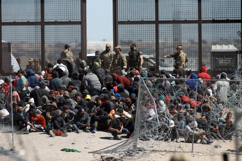 CIUDAD JUAREZ , MEXICO - MARCH 21: Hundreds of foreigners who camped at the border, broke the fence with their hands, sticks and different tools they had, placed blankets over the spikes and entered the United States, through the area known as Gate 36 in Ciudad Juarez, Mexico on March 21, 2024. American authorities kneeled migrants waiting to be processed. On the Mexican side, an operation is implemented by the Municipal Police and the National Migration Institute, who they remained waiting for what might happen. (Photo by Christian Torres/Anadolu via Getty Images)