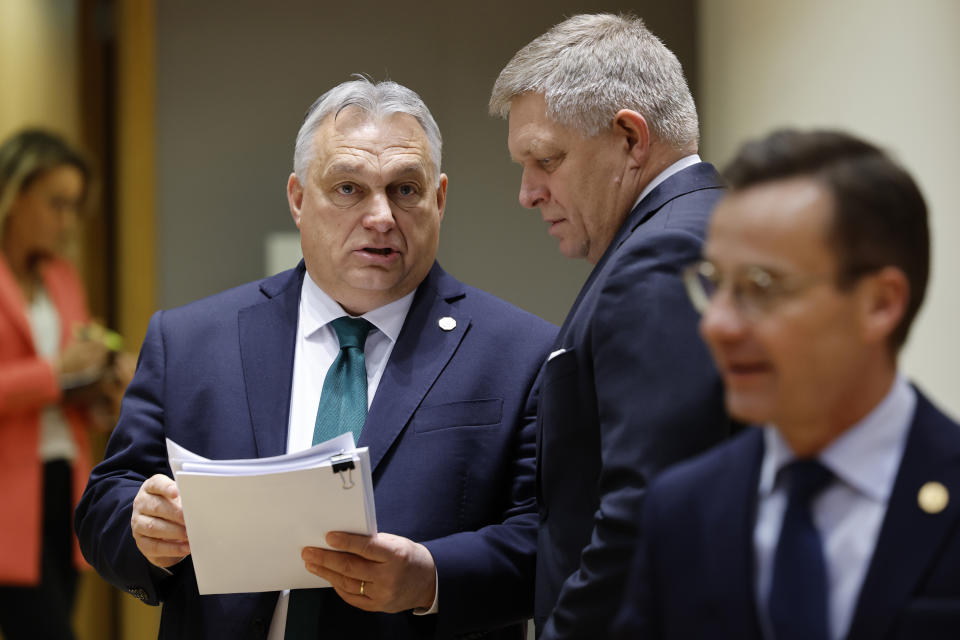 Slovakia's Prime Minister Robert Fico, right, talks to Hungary's Prime Minister Viktor Orban during a round table meeting at an EU summit in Brussels, Thursday, Feb. 1, 2024. European Union leaders meet in Brussels for a one day summit to discuss the revision of the Multiannual Financial Framework 2021-2027, including support for Ukraine. (AP Photo/Geert Vanden Wijngaert)