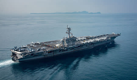 The U.S. aircraft carrier USS Carl Vinson transits the Sunda Strait, Indonesia on April 15, 2017. Picture taken on April 15, 2017. Sean M. Castellano/Courtesy U.S. Navy/Handout via REUTERS