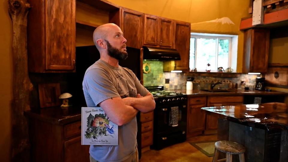 Rod Collen stands in a house that he built with his fiancé from the ground up on their property in Lakebay, Wash. August 13, 2022. The couple spoke with The News Tribune for an article about the home near Penrose State Park.