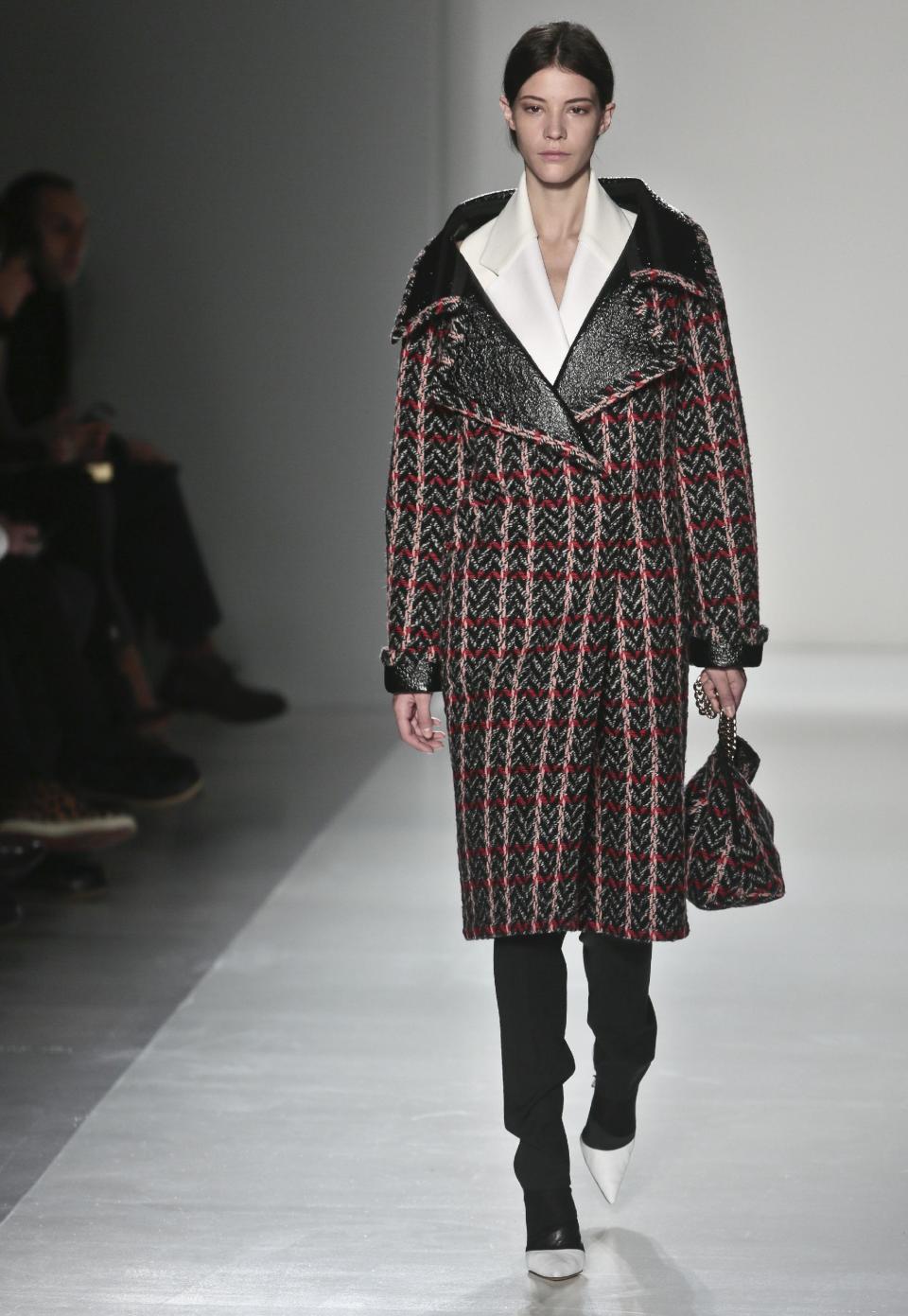 Fashion from the Victoria Beckham Fall 2014 collection is modeled, during New York Fashion Week on Sunday Feb. 9, 2014. (AP Photo/Bebeto Matthews)