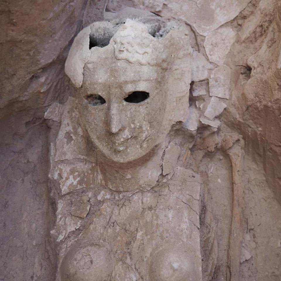 A burial mask showing the face of a woman with holes for the eyes - MINISTRY OF TOURISM AND ANTIQUTIES HANDOUT/EPA-EFE/Shutterstock 