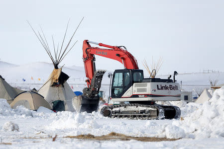 Crews remove waste from the opposition camp against the Dakota Access oil pipeline near Cannon Ball, North Dakota, U.S., February 8, 2017. REUTERS/Terray Sylvester