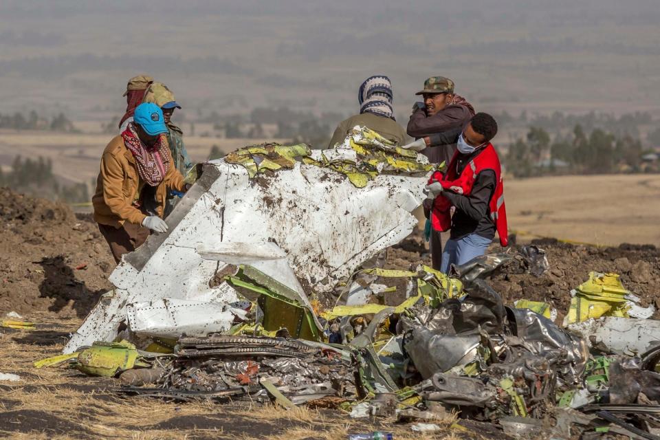 Rescuers work at the scene of the Ethiopian Airlines flight crash (AP)