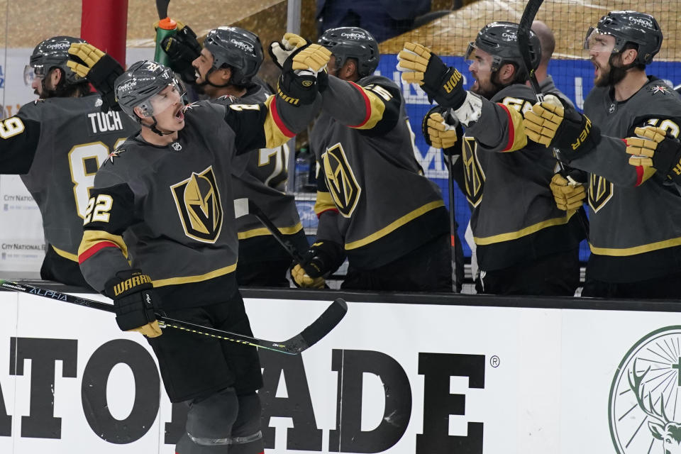 Vegas Golden Knights defenseman Nick Holden (22) celebrates after scoring against the Montreal Canadiens during the third period in Game 1 of an NHL hockey Stanley Cup semifinal playoff series Monday, June 14, 2021, in Las Vegas. (AP Photo/John Locher)