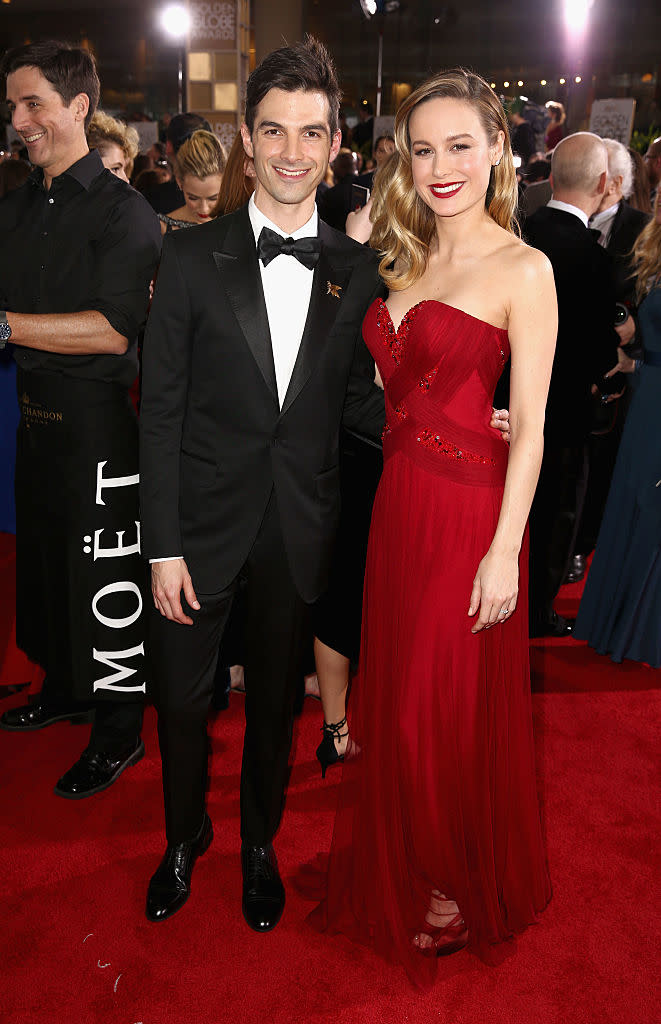 <p>A dapper Alex Greenwald walked the red carpet alongside fiancée Brie Larson, who stunned in a form-fitting red gown. </p>