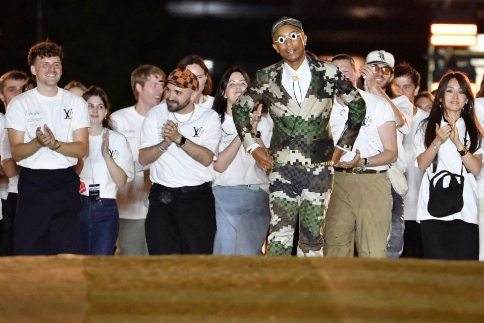 US Louis Vuitton' fashion designer and singer Pharrell Williams acknowledges the audience at the end of the Louis Vuitton Menswear Spring-Summer 2024 show as part of the Paris Fashion Week on the Pont Neuf, central Paris, on June 20, 2023. (Photo by JULIEN DE ROSA / AFP) (Photo by JULIEN DE ROSA/AFP via Getty Images) ORIG FILE ID: AFP_33KH3E9.jpg