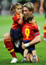 Fernando Torres of Spain holds his children Nora Torres (L) and Leo Torres (R) after the UEFA EURO 2012 final match between Spain and Italy at the Olympic Stadium on July 1, 2012 in Kiev, Ukraine. (Photo by Jasper Juinen/Getty Images)