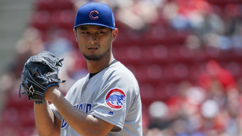 Chicago Cubs starting pitcher Yu Darvish prepares to throw in the second inning of a baseball game against the Cincinnati Reds, Sunday, May 20, 2018, in Cincinnati. (AP Photo/John Minchillo)