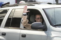 Lansdowne Police Officer David Schiazza who was injured while responding to reported standoff the previous day, waves as he leaves the hospital in Philadelphia, Thursday, Feb. 8, 2024. (AP Photo/Matt Rourke)