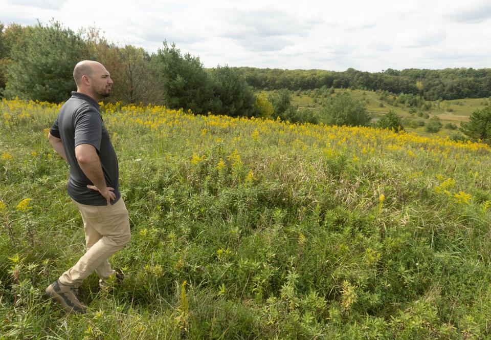 Billy Meismer, planning and capital projects coordinator for Stark Parks, looks out over property in Pike Township that once held the city wastewater plant and sludge farm. Stark Parks is turning it into a park geared toward horse riding and hiking.