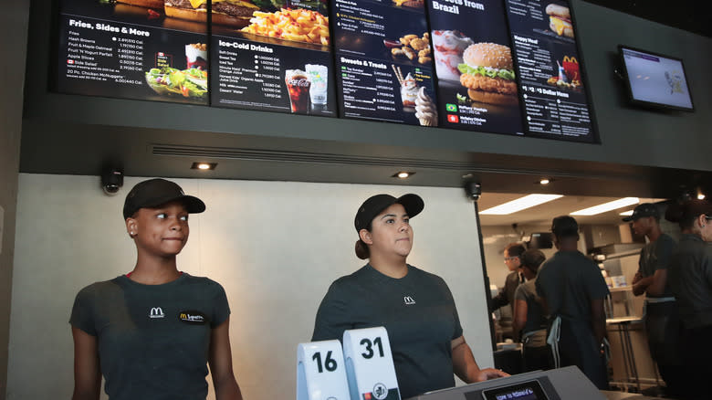 Two McDonald's employees at register