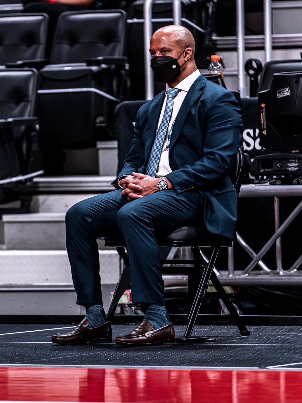 Rob Murphy sits courtside during a 2021 NBA game between the Detroit Pistons and Orlando Magic at Little Caesars Arena.