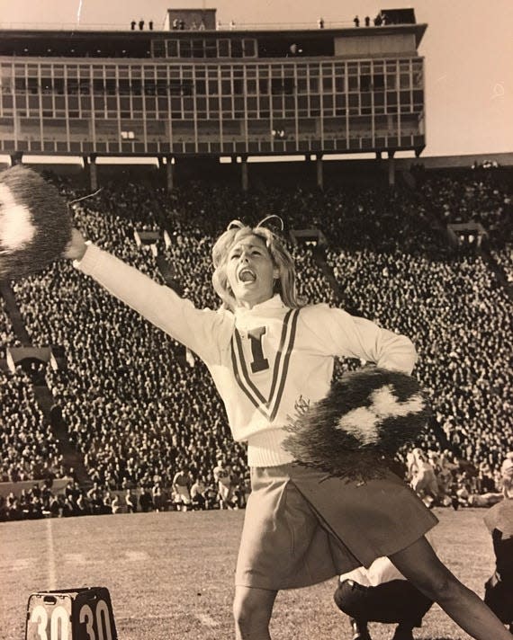 E. Jean Carroll cheerleading at Indiana University in 1965.