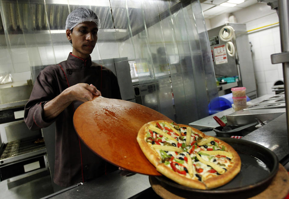 Pizza Hut's meat-free sausage pizza is thought to be the first widely distributed takeaway pizza which has a topping of meat substitute. Photo: Danish Siddiqui/Reuters