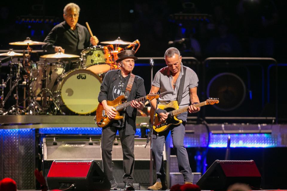 Bruce Springsteen plays guitar with Nils Lofgren as they perform with the E Street Band at the BOK Center on Tuesday, February 21, 2023, in Tulsa, Okla.