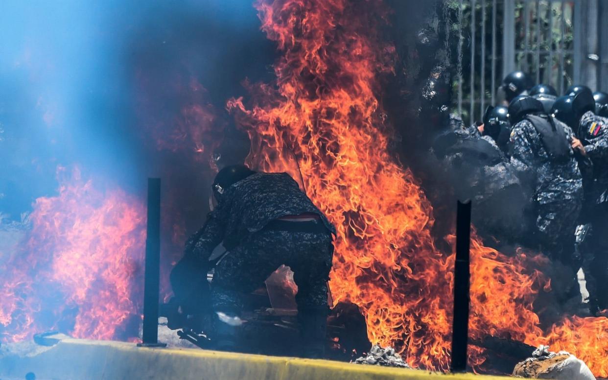 An explosive device was detonated at protests in Caracas - AFP