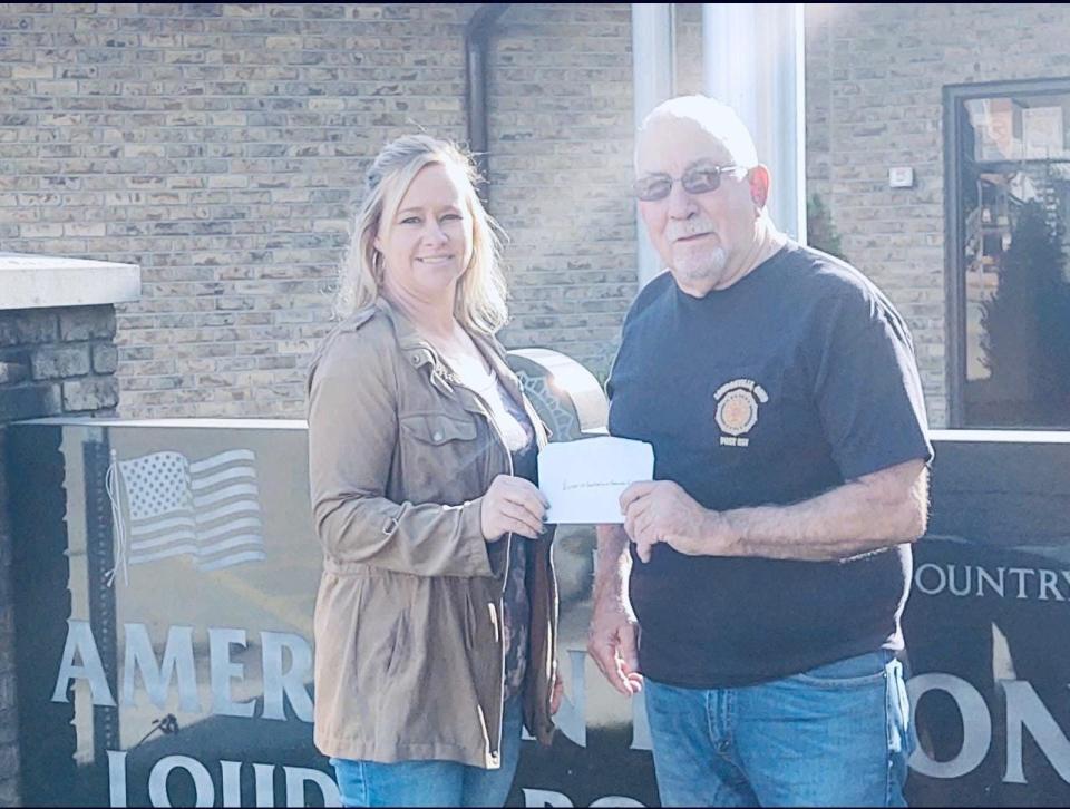 Loudonville Chamber of Commerce Executive Director Valerie Spreng accepts a check of $15,982.98 for the Chamber's Fireworks Fund for the 2022 Fourth of July fireworks show. Funds were raised through the Legion's charitable games account.
