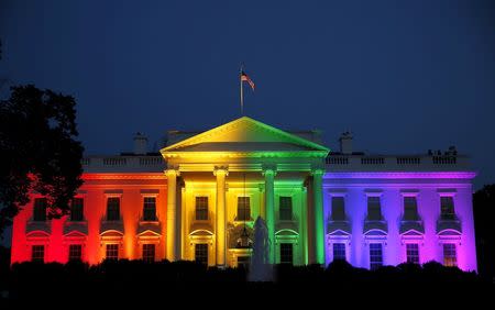 The White House is illuminated in rainbow colors after today's historic Supreme Court ruling legalizing gay marriage in Washington June 26, 2015. REUTERS/Gary Cameron