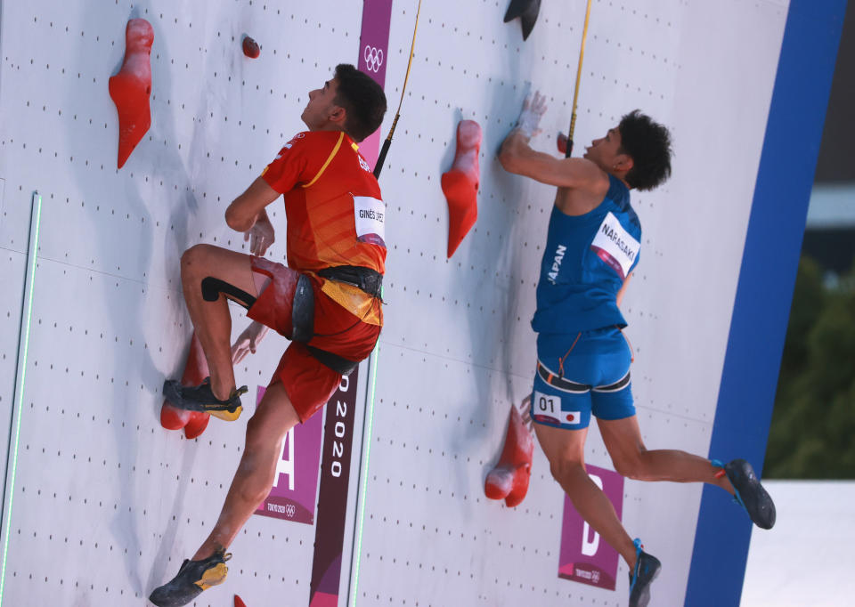 Tokyo 2020 Olympics - Sport Climbing - Men's Speed - Final - Aomi Urban Sports Park - Tokyo, Japan - August 5, 2021.Tomoa Narasaki of Japan and Alberto Gines Lopez of Spain in action REUTERS/Yara Nardi