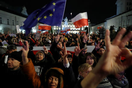 People gather in front of the Presidential Palace during a protest against judicial reforms in Warsaw, Poland, November 24, 2017. REUTERS/Kacper Pempel