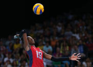 <b>Destinee Hooker - United States - Volleyball - Opposite Attacker</b> <br> Destinee Hooker of United States serves in the Women's Volleyball Preliminary match between the United States and Brazil on Day 3 of the London 2012 Olympic Games at Earls Court on July 30, 2012 in London, England. (Photo by Elsa/Getty Images)