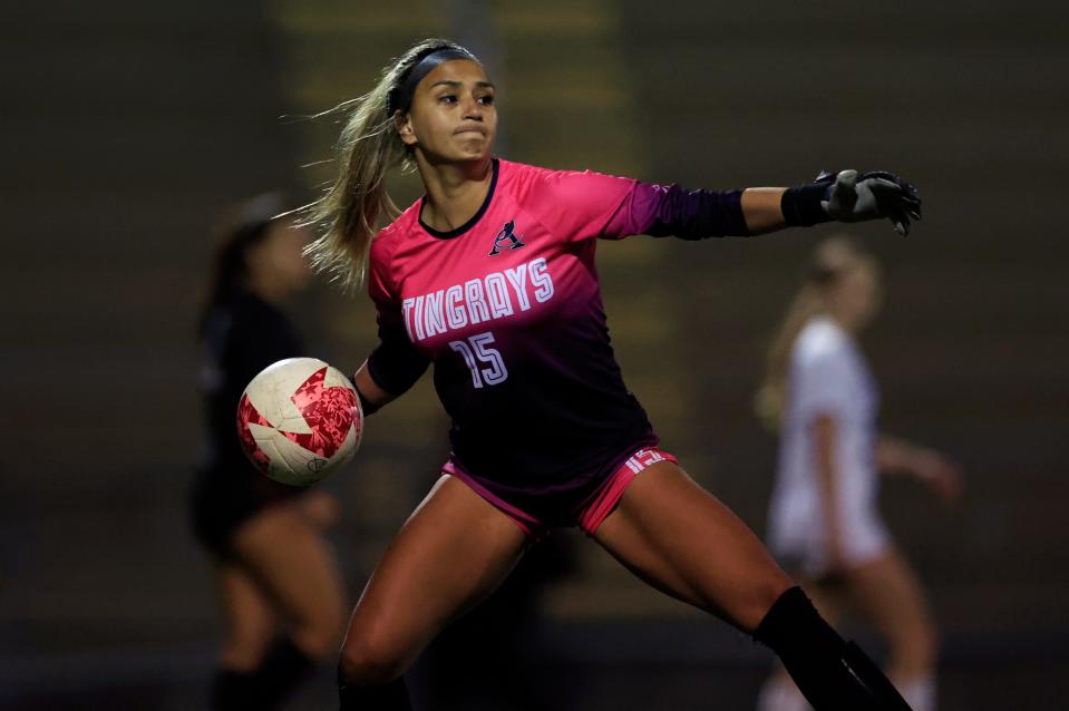 Atlantic Coast's Gaby Rourke (15) clears the net during the first half of a Gateway Conference semifinal against Stanton.