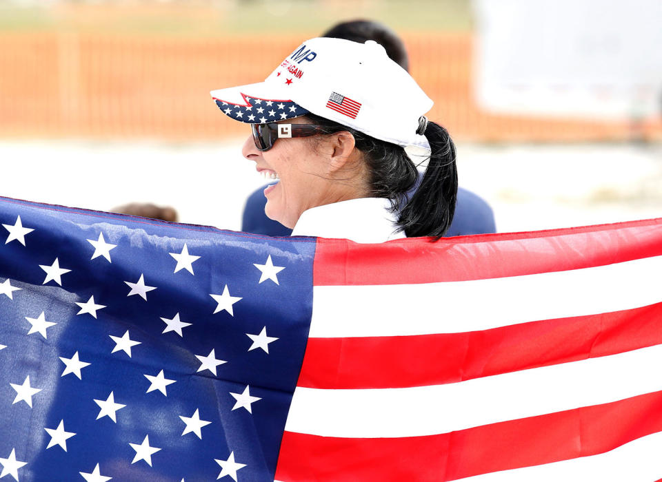 <p>A supporter of US President Donald Trump brandishes a US flag at a rally at the Orlando Melbourne International Airport on February 18, 2017. (Gregg Newton/Getty Images) </p>