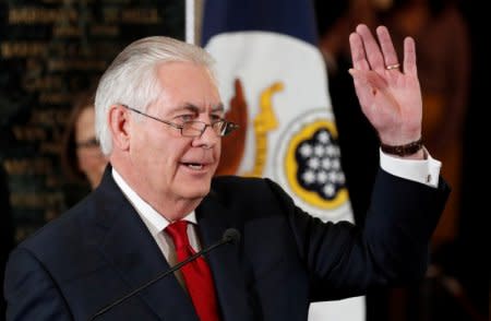 Outgoing U.S. Secretary of State Rex Tillerson waves to applauding workers after delivering his parting remarks at the State Department in Washington, U.S., March 22, 2018.  REUTERS/Kevin  Lamarque