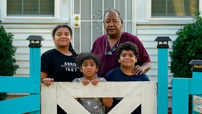 Angelo Bernard (center, right), who lives near the Denka Performance Elastomer Plant, poses with his grandchildren, visiting him Friday at his home for the weekend in Reserve, Louisiana. From left are Korinne Bernard, 11; Karmen Bernard, 9, and Anthony Bernard, 10, who used to attend Fifth Ward Elementary until Hurricane Ida forced them to move. “I feel for the kids that have to go to school that close to the plant,” Angelo Bernard said. (Photo: Gerald Herbert/AP)