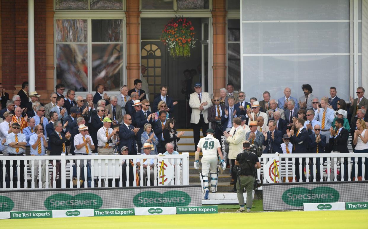 Australia batsman Steve Smith is applauded by MCC members as he walks back into the pavilion after being dismissed by Chris Woakes - GETTY IMAGES