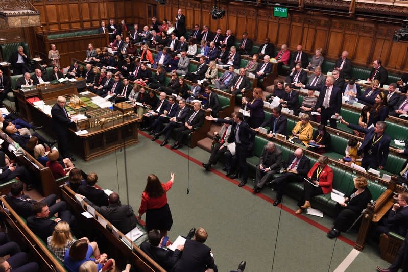 Britain's Prime Minister Boris Johnson reacts as MPs gesture at the House of Commons in London