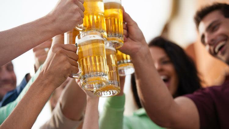 Friends sharing beers at a festival