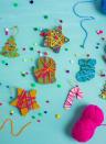 <p>For this simple project, gather the kids to paint pre-cut wooden ornaments. When dry, they can have fun wrapping them with colored yarn in cheerful hues. </p><p><a href="https://designimprovised.com/2018/12/yarn-wrapped-christmas-ornaments.html" rel="nofollow noopener" target="_blank" data-ylk="slk:Get the tutorial at Design Improvised »;elm:context_link;itc:0;sec:content-canvas" class="link "><em>Get the tutorial at Design Improvised »</em></a></p><p><a class="link " href="https://www.amazon.com/Mira-Handcrafts-Assorted-Colors-Acrylic/dp/B01IDI35HA/?tag=syn-yahoo-20&ascsubtag=%5Bartid%7C10055.g.34112389%5Bsrc%7Cyahoo-us" rel="nofollow noopener" target="_blank" data-ylk="slk:Shop Now;elm:context_link;itc:0;sec:content-canvas">Shop Now</a></p>