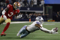 Dallas Cowboys wide receiver Cedrick Wilson, right, cannot catch a pass in front of San Francisco 49ers safety Jaquiski Tartt (3) during the second half of an NFL wild-card playoff football game in Arlington, Texas, Sunday, Jan. 16, 2022. (AP Photo/Roger Steinman)