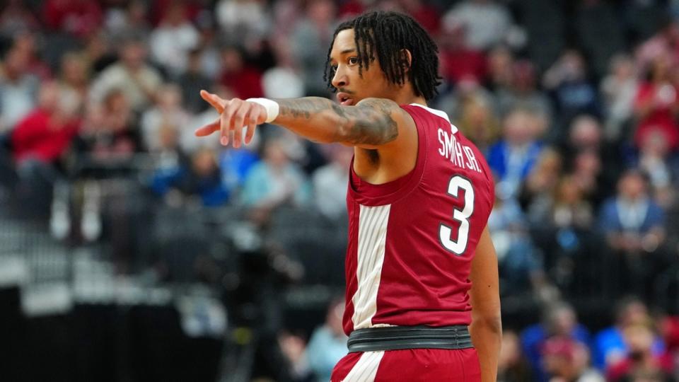 Arkansas Razorbacks guard Nick Smith Jr.  (3) gestures against the UConn Huskies during the first half at T-Mobile Arena