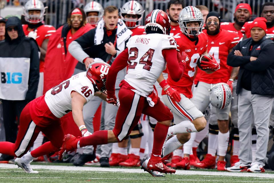 Ohio State wide receiver Jayden Ballard, right, tries to get past Indiana linebacker Isaiah Jones, left, and defensive back Bryson Bonds during an NCAA college football game Saturday, Nov. 12, 2022 in Columbus, Ohio. Ohio State won 56-14.