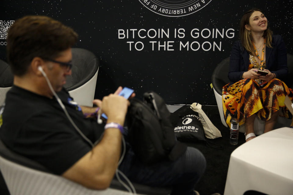 A sign that reads Bitcoin is going to the moon is seen in the exhibition hall during the Bitcoin 2022 Conference at Miami Beach Convention Center on April 8, 2022 in Miami, Florida. (Photo by Marco Bello/Getty Images)