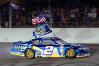 Brad Keselowski, driver of the #2 Miller Lite Dodge, celebrates after winning the series championship and finishing in fifteenth place for the NASCAR Sprint Cup Series Ford EcoBoost 400 at Homestead-Miami Speedway on November 18, 2012 in Homestead, Florida. (Photo by Chris Graythen/Getty Images)