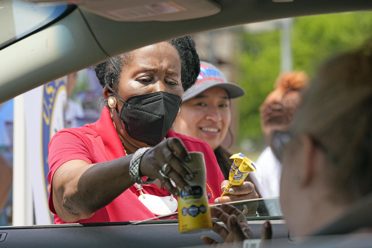 Rep. Sheila Jackson Lee, D-Texas, hands out infant formula during a baby formula drive to help with the shortage Saturday, May 14, 2022, in Houston. Parents seeking baby formula are running into bare supermarket and pharmacy shelves in part because of ongoing supply disruptions and a recent safety recall. (AP Photo/David J. Phillip)