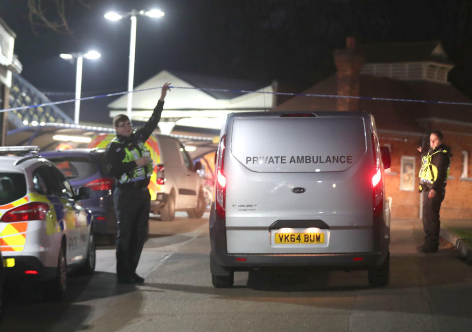 A private ambulance arrives at Horsley station near Guildford, Surrey, after a murder inquiry was launched following the stabbing of a man on board a train in Surrey.