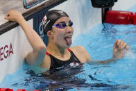 Yui Ohashi, of Japan, celebrates after winning the women's 200-meter individual medley final at the 2020 Summer Olympics, Wednesday, July 28, 2021, in Tokyo, Japan. (AP Photo/Charlie Riedel)