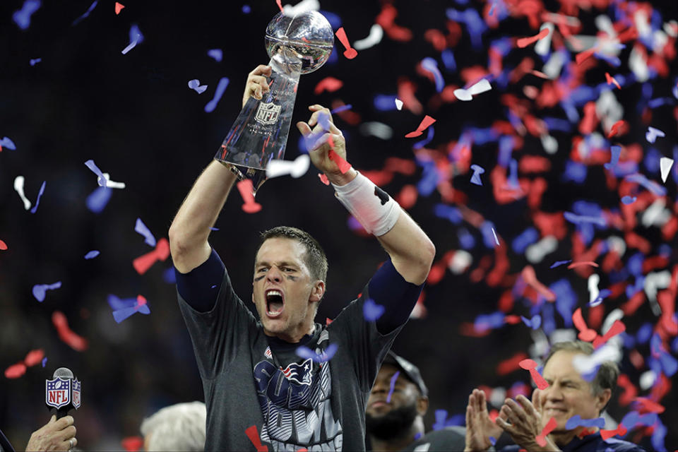 Tom Brady celebrates after the New England Patriots defeat the Atlanta Falcons in Super Bowl LI in Houston in 2017 - Credit: AP