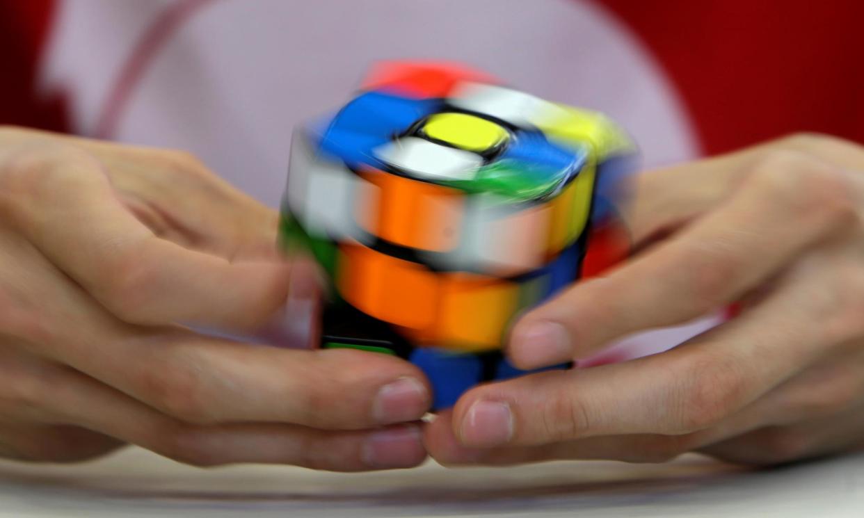 <span>In a spin: a competitor solves a Rubik's cube during the Rubik's Cube European Championship in Prague, Czech Republic.</span><span>Photograph: David W Černý/Reuters</span>