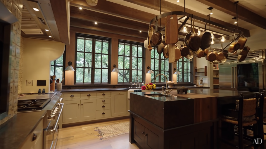 Jared and Genevieve Padalecki's large rustic, beige and brown kitchen